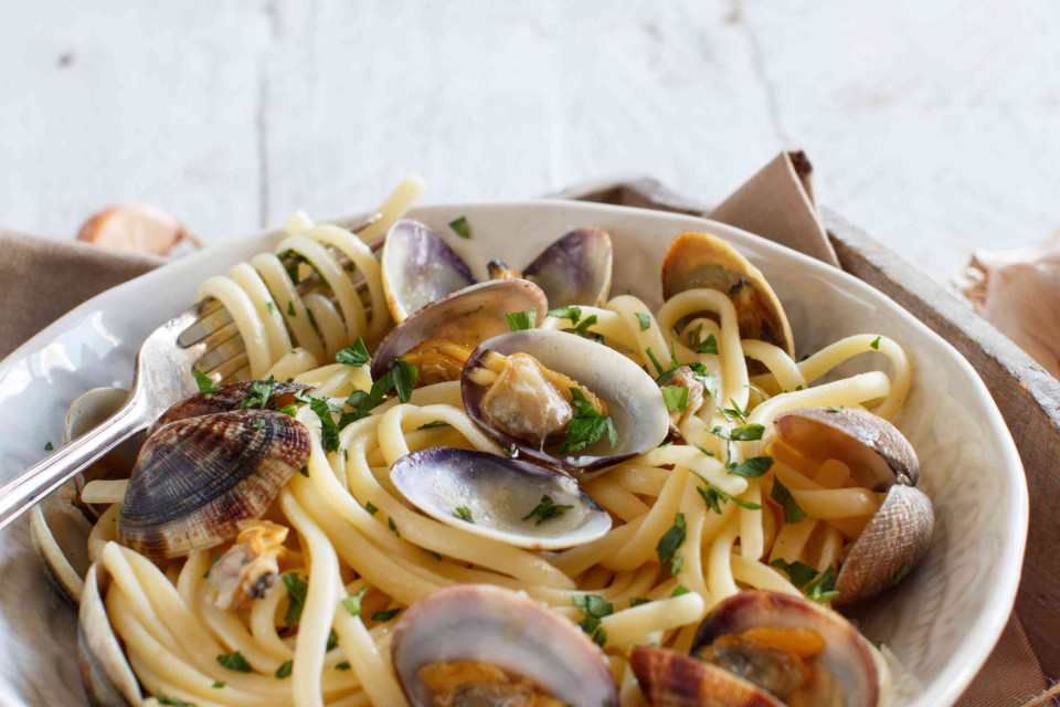 <p data-start="207" data-end="237"><strong data-start="207" data-end="237">Linguine alle Vongole 🐚🍋</strong></p>
<p data-start="239" data-end="372">A classic coastal dish: simple, fresh and full of flavour.<br data-start="299" data-end="302">Perfect for late summer dinners with chilled white wine and salty air.</p>
<p data-start="374" data-end="631"><strong data-start="374" data-end="390">You&rsquo;ll need:</strong><br data-start="390" data-end="393">&bull; 400g linguine<br data-start="408" data-end="411">&bull; 1kg fresh clams (vongole), rinsed well<br data-start="451" data-end="454">&bull; 2 garlic cloves, thinly sliced<br data-start="486" data-end="489">&bull; A pinch of chili flakes (optional)<br data-start="525" data-end="528">&bull; A small bunch of fresh parsley, chopped<br data-start="569" data-end="572">&bull; Olive oil<br data-start="583" data-end="586">&bull; 100ml dry white wine<br data-start="608" data-end="611">&bull; Lemon zest + juice</p>
<p data-start="633" data-end="646"><strong data-start="633" data-end="644">How to:</strong></p>
<ol data-start="647" data-end="1089">
<li data-start="647" data-end="721">
<p data-start="650" data-end="721">Cook linguine al dente in salted water. Reserve a cup of pasta water.</p>
</li>
<li data-start="722" data-end="802">
<p data-start="725" data-end="802">In a large pan, saut&eacute; garlic in olive oil until fragrant. Add chili flakes.</p>
</li>
<li data-start="803" data-end="919">
<p data-start="806" data-end="919">Add clams and pour in the wine. Cover and let steam for 5&ndash;7 min until clams open. Discard any that stay closed.</p>
</li>
<li data-start="920" data-end="1021">
<p data-start="923" data-end="1021">Add drained pasta to the pan, toss gently with the clams. Add a splash of pasta water if needed.</p>
</li>
<li data-start="1022" data-end="1089">
<p data-start="1025" data-end="1089">Finish with parsley, lemon zest and a drizzle of good olive oil.</p>
</li>
</ol>
<p data-start="1091" data-end="1131">Serve immediately. <em data-start="1004" data-end="1018">Bon app&eacute;tit.</em> 🤍</p>
<p data-start="1133" data-end="1226">#pureeat #lacuisinepure #linguineallevongole #simplemeals #coastalflavour #lescouleursdumonde&nbsp;</p>