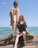 <p>The combination of neutral tones and fringe details creates a captivating contrast against the serene backdrop of the turquoise sea. His laid-back fringed cape pairs perfectly with lightweight, flowing trousers, embodying a rugged relaxed beachside elegance. She exudes sophistication in a black fringed cover-up adorned with a statement shell necklace, blending bohemian charm with modern flair.&nbsp;</p>