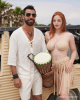 <p>From the <em>Aurales Bohemian Collection. </em>He wears a lightweight, linen tunic with a rope tie detail and matching shorts. Her look is grounded in soft, neutral tones with a sleek bikini and fringed skirt, bringing a playful yet elegant edge to beach days and beyond. Endless summer with a bohemian flair, ready for rhythm-filled moments by the sea.</p>