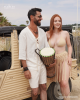 <p>Capturing the carefree spirit of summer, this duo embodies style with earthy tones and natural textures. He is dressed in a light linen tunic with rustic rope detailing, complemented by relaxed shorts that offer comfort and class for any summer day. She stuns in a neutral bikini paired with a fringe skirt that adds movement and flair, perfect for dancing by the beach or enjoying sun-filled adventures. Together, they radiate bohemian charm, ready for endless summer moments full of music, rhythm and laughter.</p>