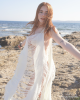<p>Feel the ocean breeze and move with the waves in this chic beach cover-up from the&nbsp;<em>Aurales Bohemian Collection</em>. With its flowing, fringed design, this piece adds movement and texture to any beach ensemble, creating a sense of freedom and lightness. The soft, cream tones blend with the coastal backdrop, offering an ethereal and serene look perfect for seaside adventures. This cover-up captures the essence of bohemian elegance and carefree summer days.</p>