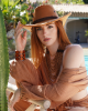 <p>Channel the earthy beauty of the desert with this chic look from the&nbsp;<em>Aurales Bohemian Collection</em>. The rich terracotta tones of the outfit flow with the natural surroundings, while the wide-brimmed hat and layered wooden jewelry evoke a sense of adventure and timeless boho style. The loose, textured fabric offers both comfort and elegance, making this the perfect ensemble for days by the pool or exploring exotic landscapes. With a touch of rustic charm and refined detailing.</p>